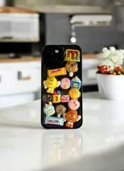 Black ChocoMania M&M Candy Case for iPhone 15